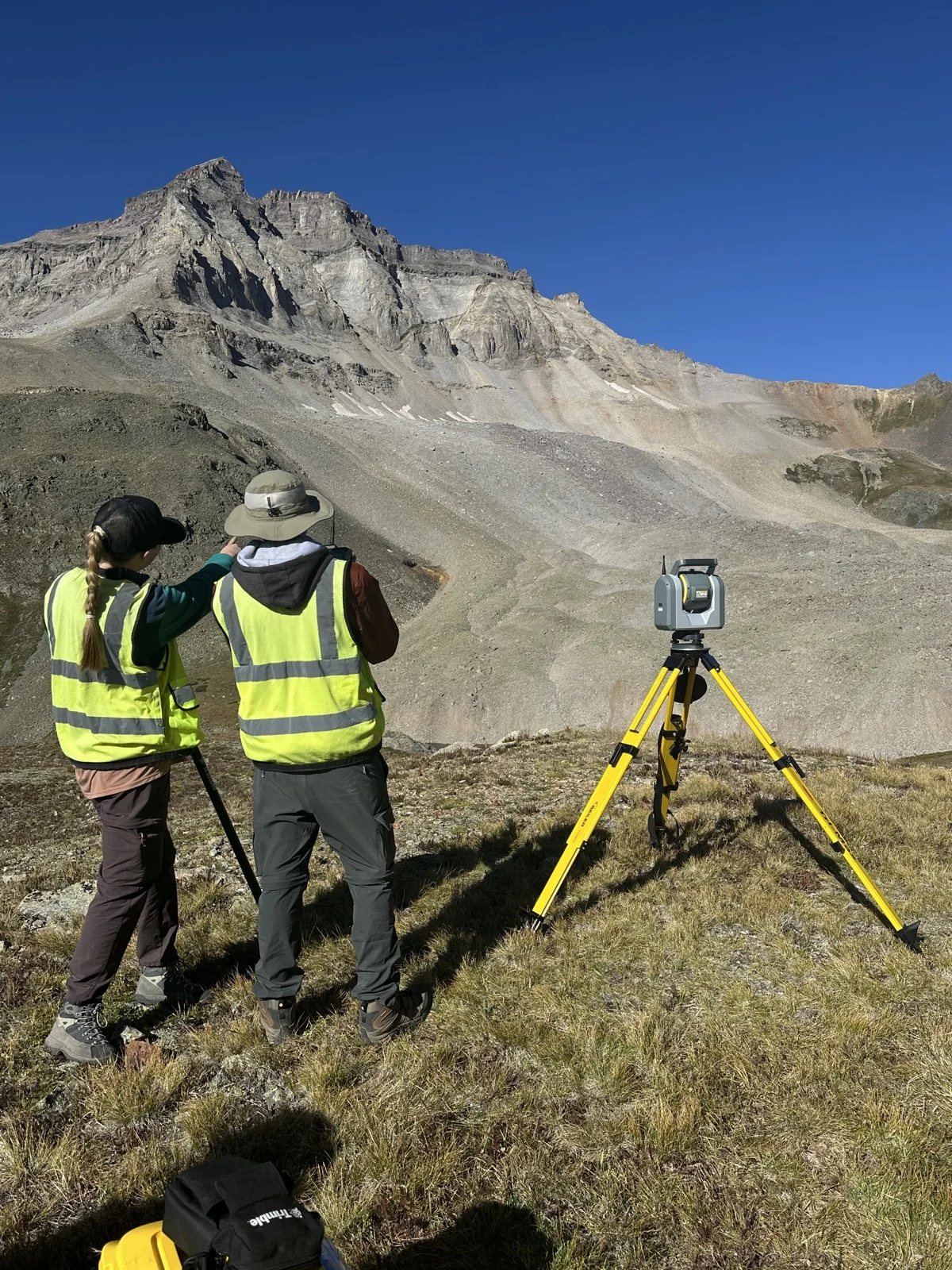 Survey team operating a Trimble total station in the Colorado Rockies